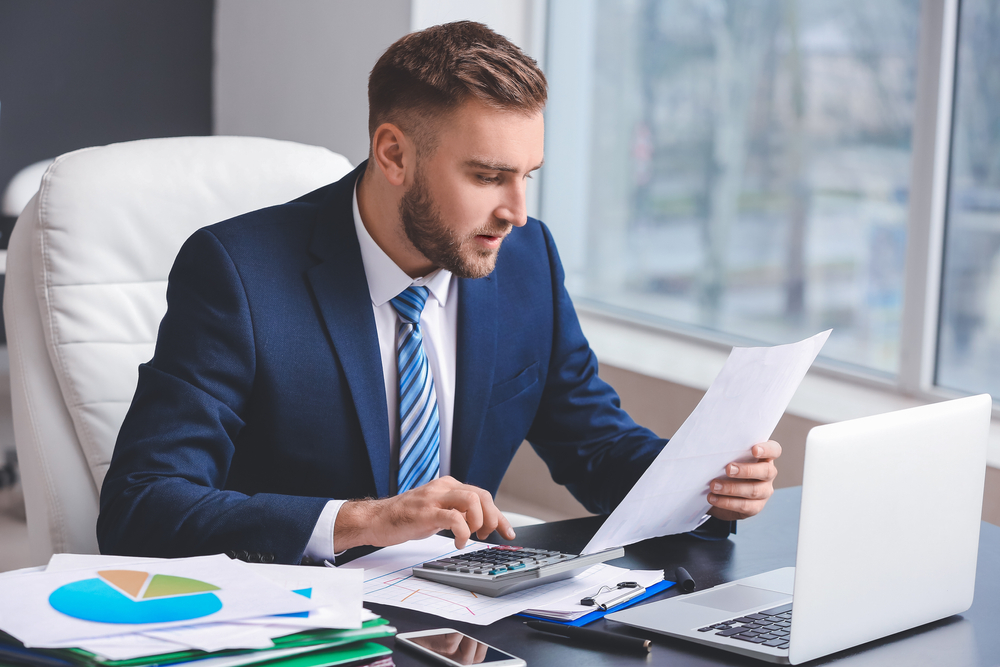 Australian accountant managing AML CTF customer due diligence and beneficial ownership with Flagship AML